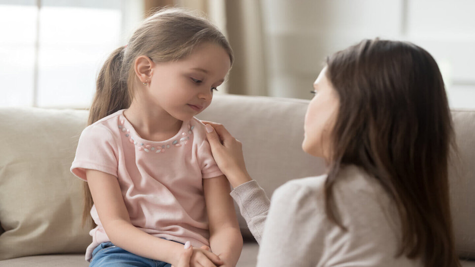 Woman and child comforting child