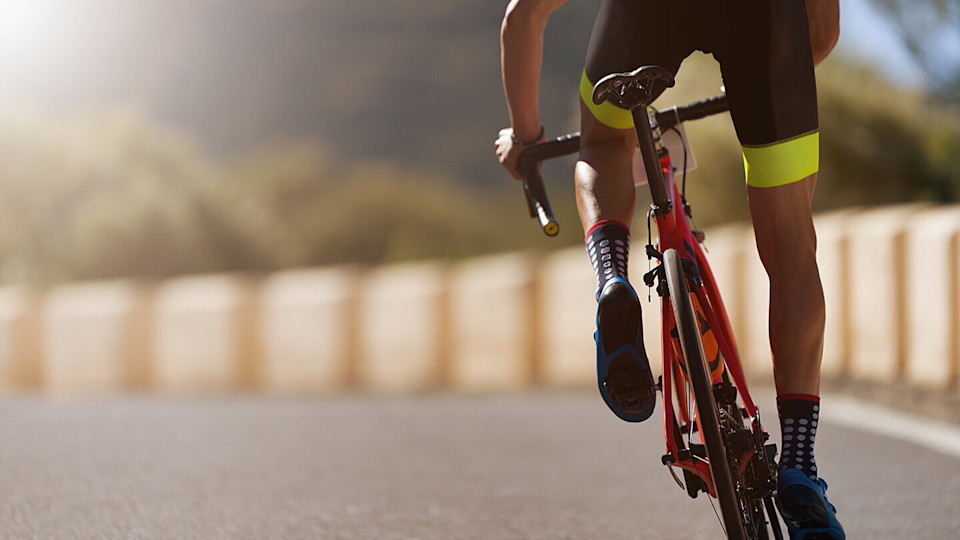 Cyclist on road close up of bike