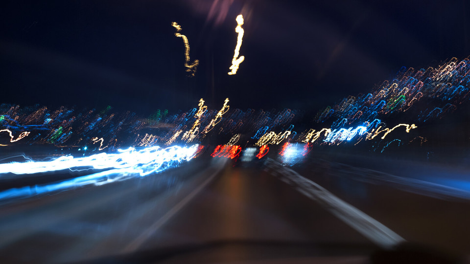Long exposure road photo at night with shaky lights.