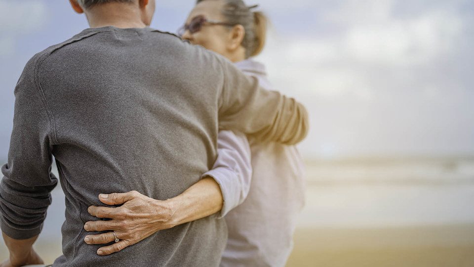 Newsroom - older couple on beach