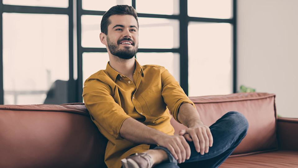 Relaxed man sitting on a sofa