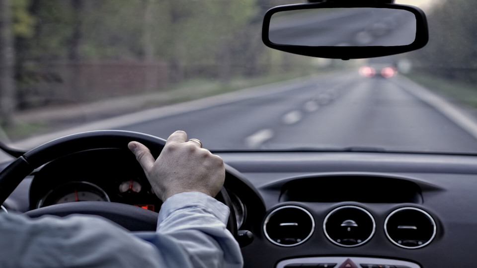 Man driving on a road