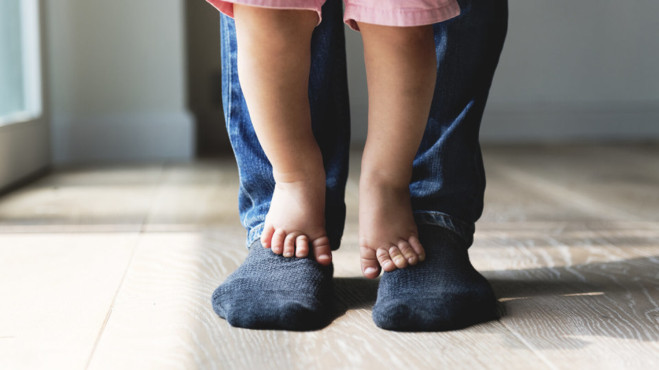 Child and parent feet together