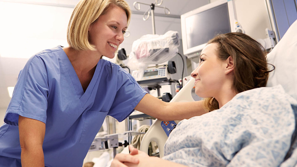 Nurse with patient in hospital