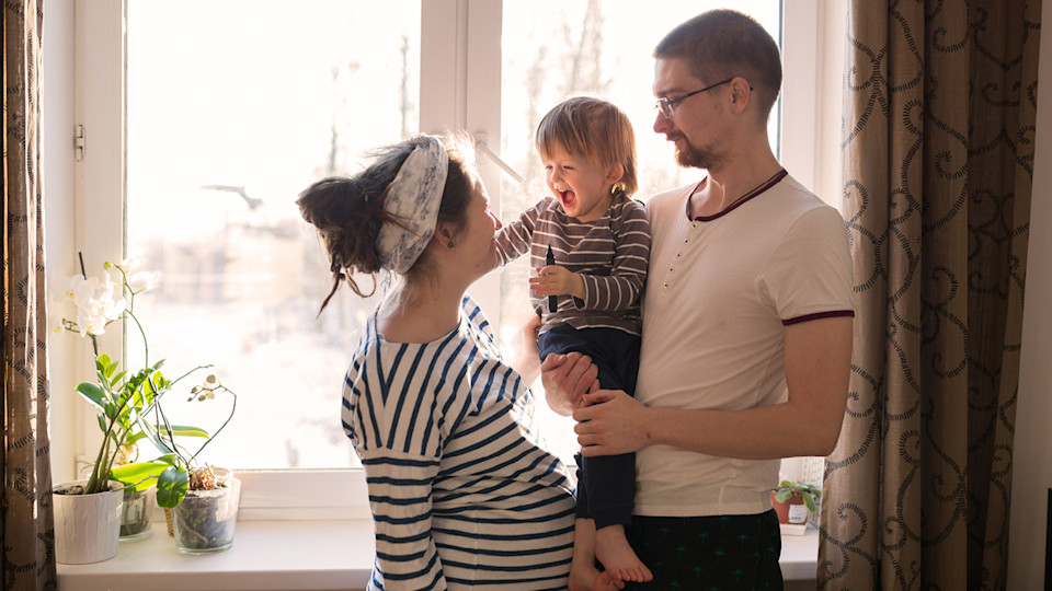Pregnant woman with partner and child