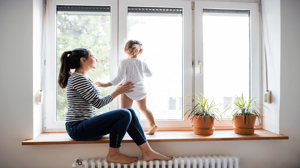 Mother and child at window