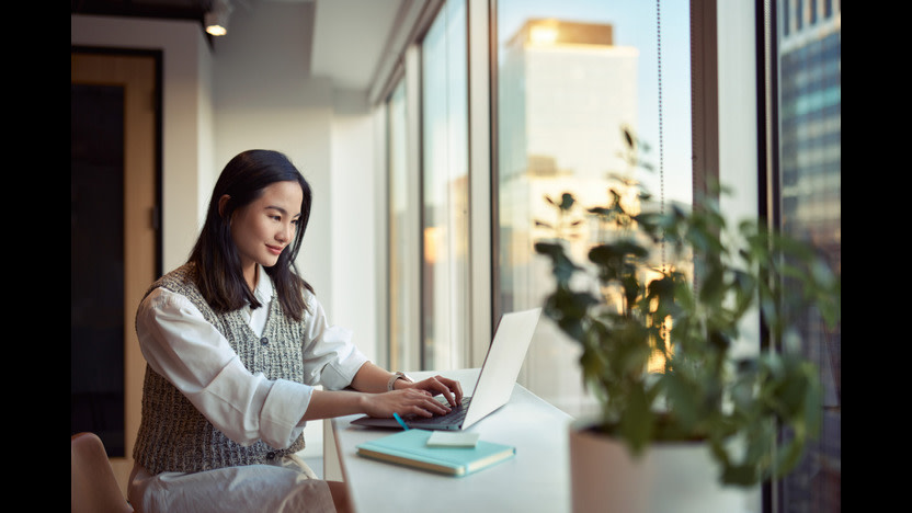 Business woman having a video call with co-worker, working online from home at cosy atmosphere. Concept of remote work from home.