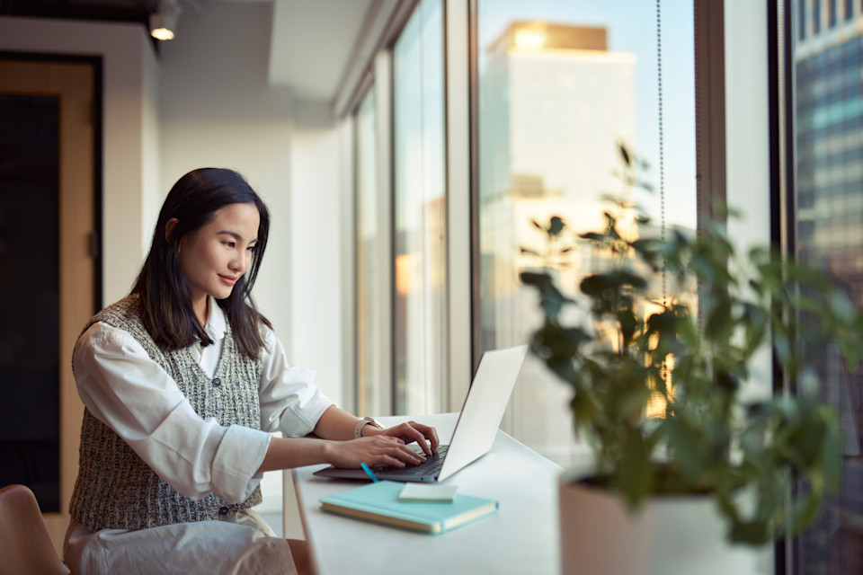 Business woman having a video call with co-worker, working online from home at cosy atmosphere. Concept of remote work from home.