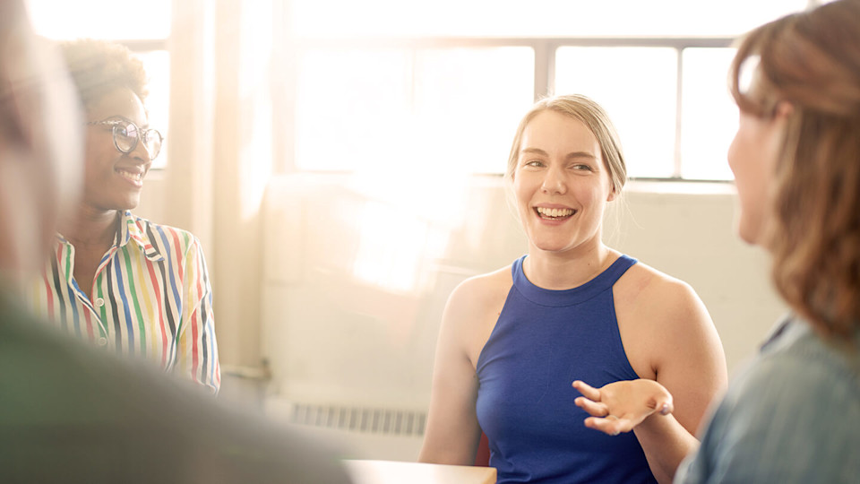 Woman smiling in an informal meeting