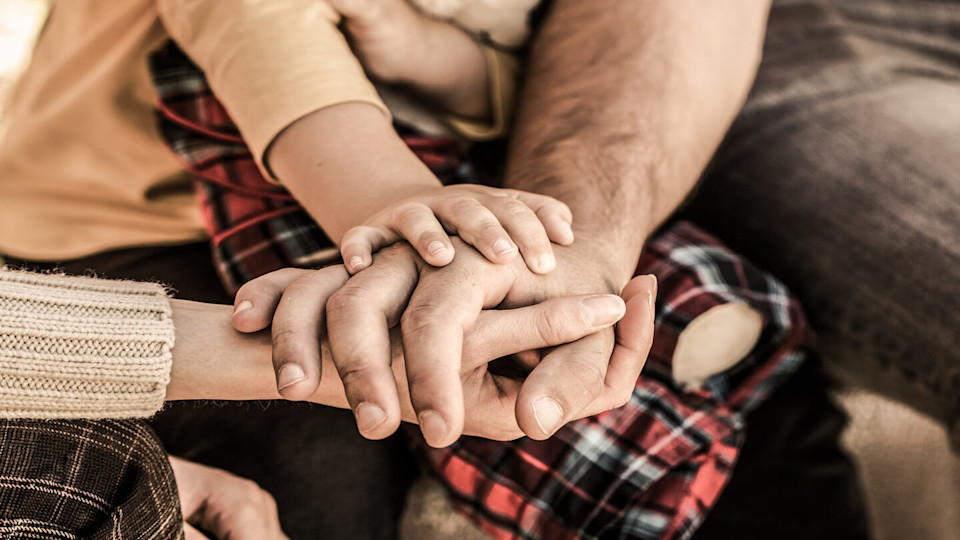 Newsroom - Family holding hands