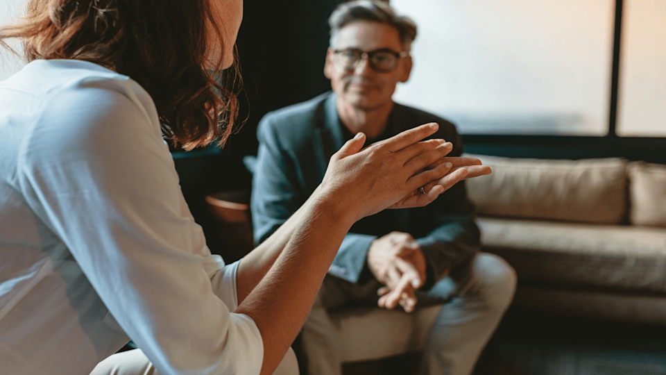 Man and woman talking in counselling scenario