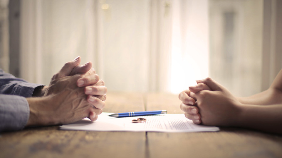divorce separation couple hands signing contract