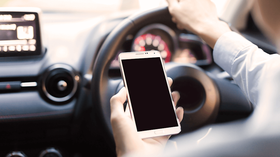 Man on mobile phone while driving