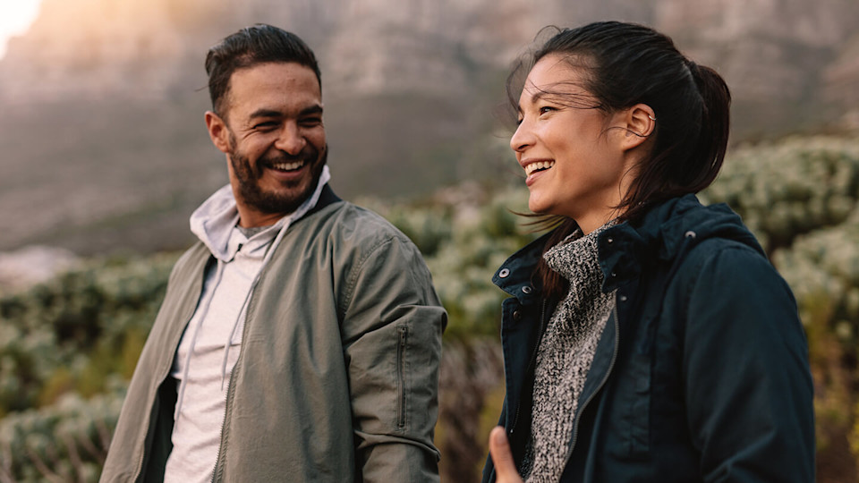 Two friends laughing in nature