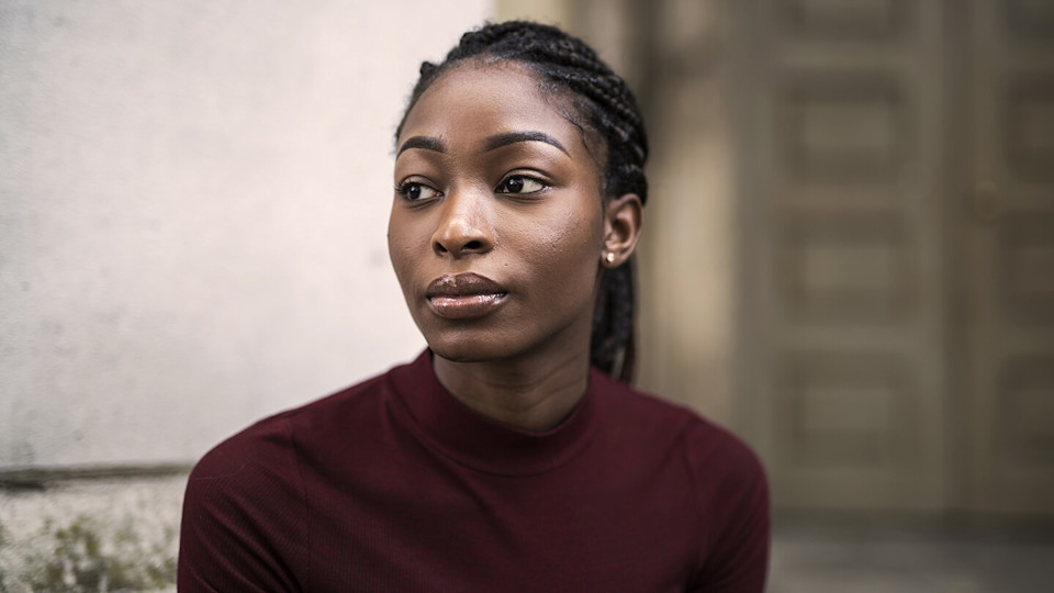 Pensive woman looking into distance