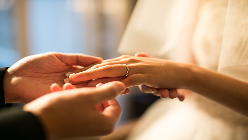 Newsroom - Husband holding wife's hand