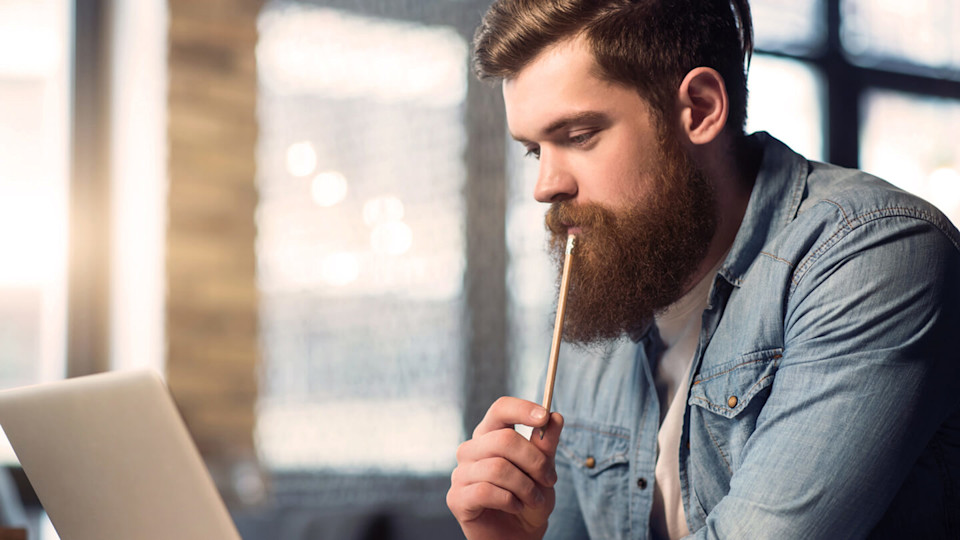 Student at a coffee shop working on laptop