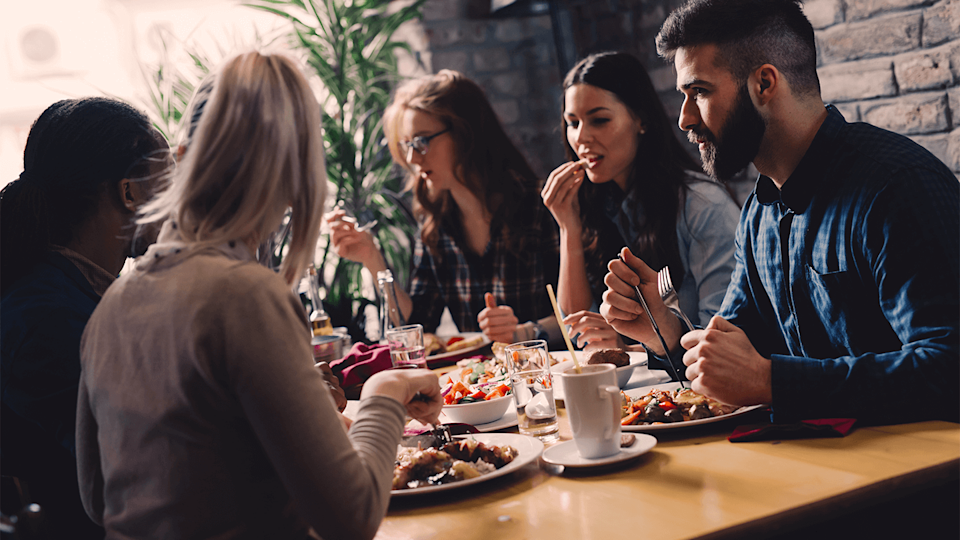 group of friends sat around table