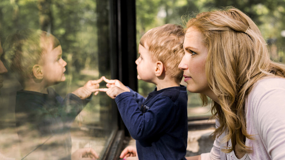 Mother and son at the zoo together