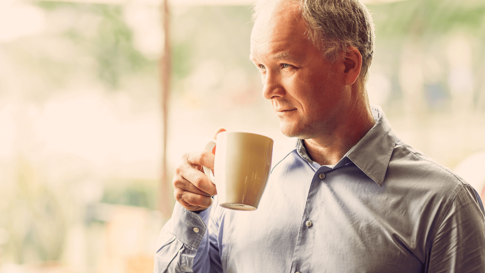 Closeup of Pensive Middle-aged Man Drinking Tea
