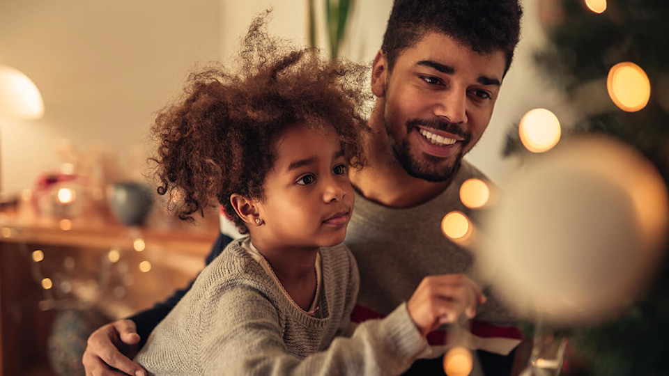 Man with young girl at Christmas