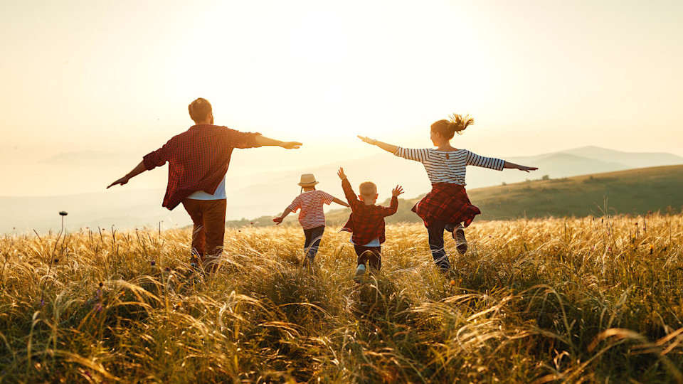 Newsroom - Family running on a hill