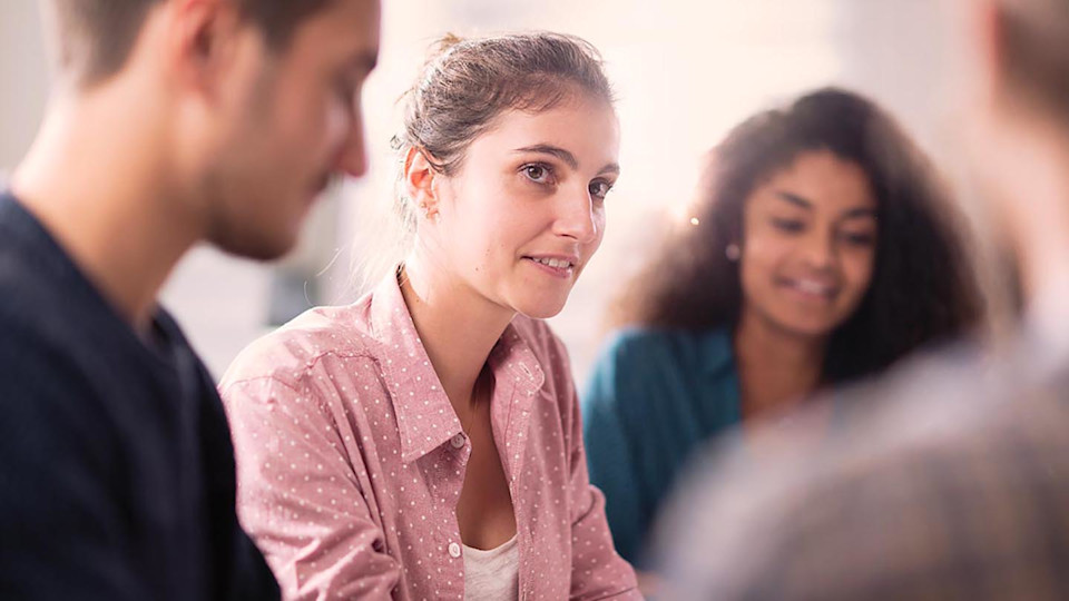 Woman in group smiling